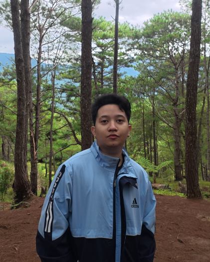 Person standing in a forest.